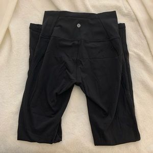 Lululemon black leggings with sheer panels on legs